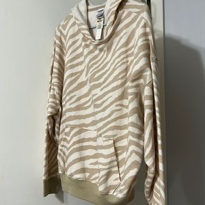 Pink hoodie in cream and tan size small